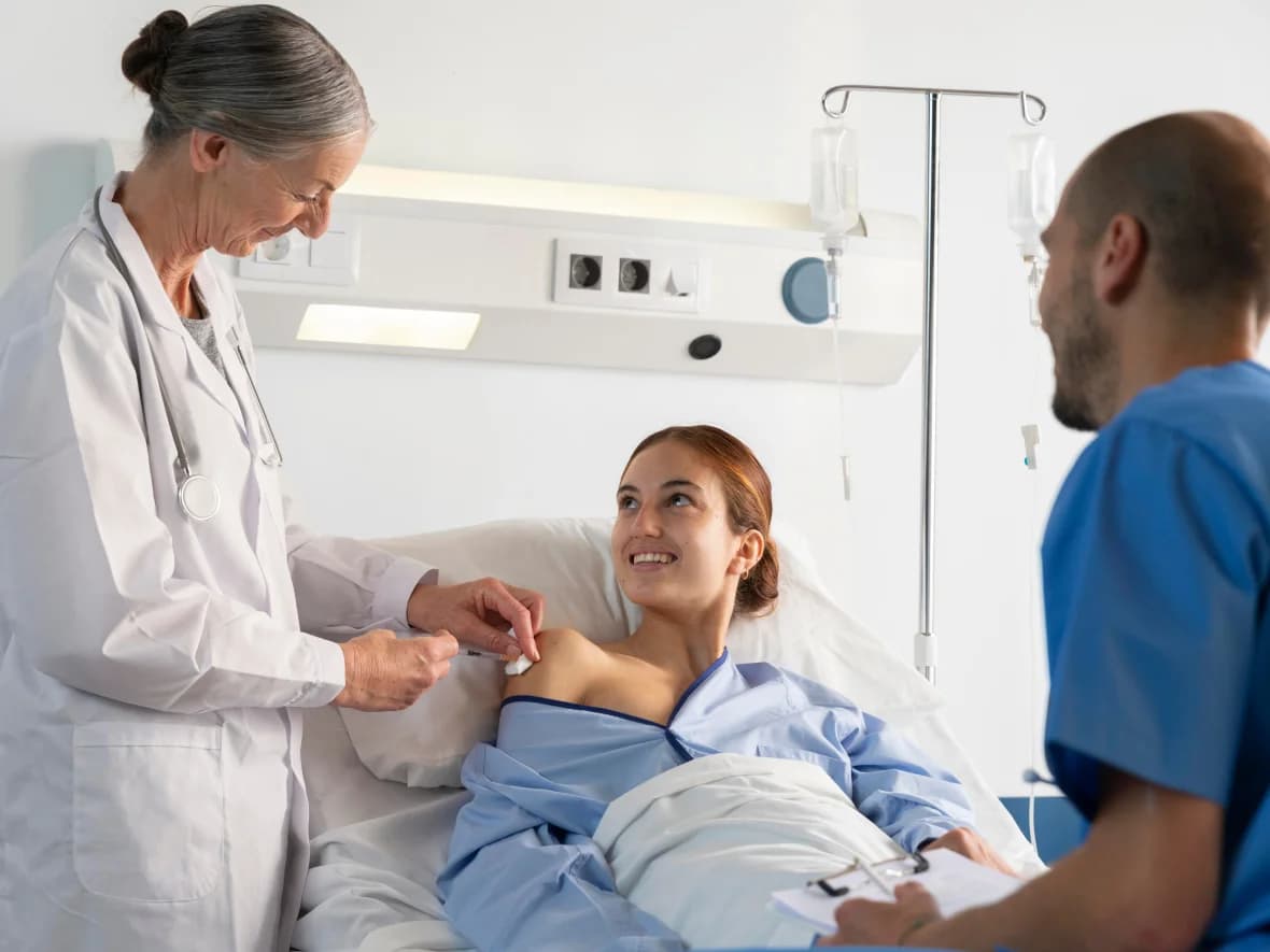 A doctor talking with a couple about their treatment