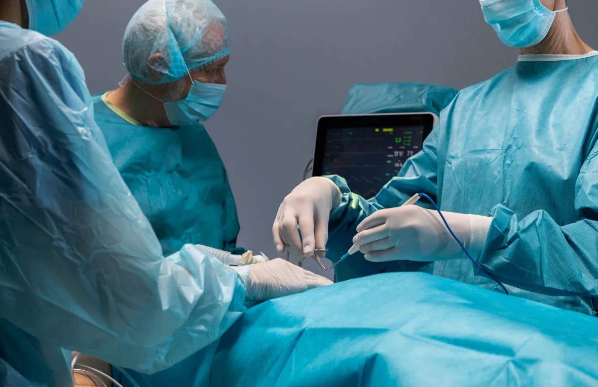 Surgeons performing a laparoscopic procedure