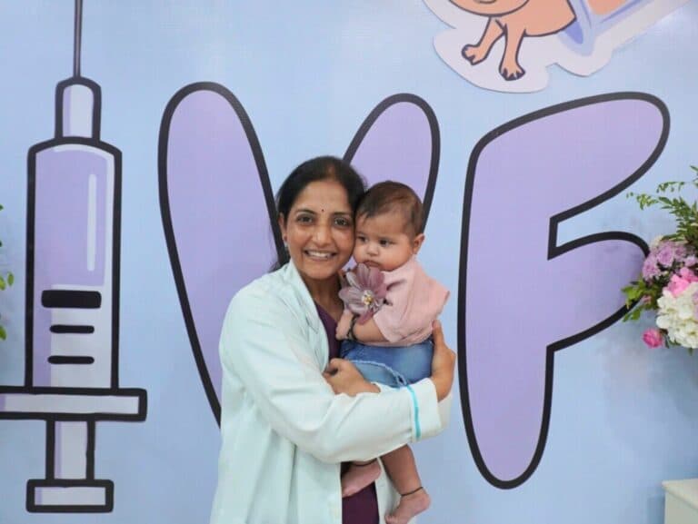 Dr. Zeepee Godha holding a baby born after treatment at Ishwa IVF